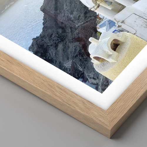 Poster in einem Rahmen aus heller Eiche - Santorini - an die Felsen gekuschelt - 60x60 cm
