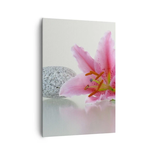 Bild auf Leinwand - Leinwandbild - Rosa Lilienblüte mit Steinen auf hellem Hintergrund - 70x100cm - Eine Studie in Pink, Grau und Weiß - Moderne Wanddekoration für Wohnzimmer und Schlafzimmer ARTTOR