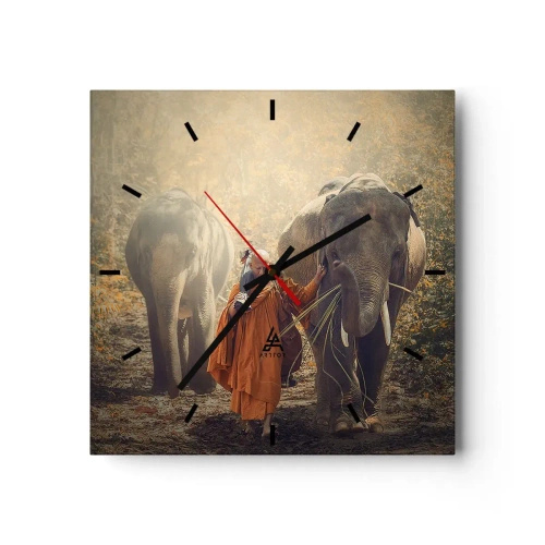 Wanduhr - Glasuhr - Ein Mönch in einer orangefarbenen Robe führt einen Elefanten durch den Wald. - 30x30cm - Volles Verständnis - Moderne Wanddekoration für Wohnzimmer und Schlafzimmer ARTTOR