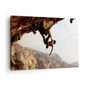 Bild auf Leinwand - Leinwandbild - Ein Kletterer auf einer steilen Klippe in den Bergen im Sonnenschein - 70x50cm - Die Welt ist in einer Hand auf einem Felsblock geschrumpft - Moderne Wanddekoration für Wohnzimmer und Schlafzimmer ARTTOR