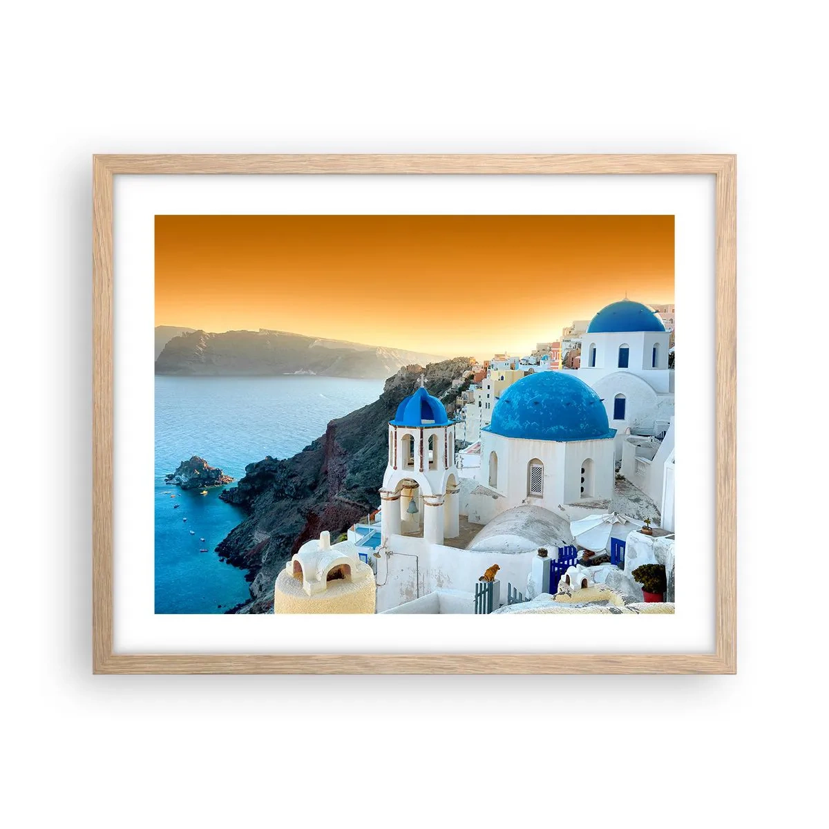 Poster in einem Rahmen aus heller Eiche - Santorini - an die Felsen gekuschelt - 50x40 cm