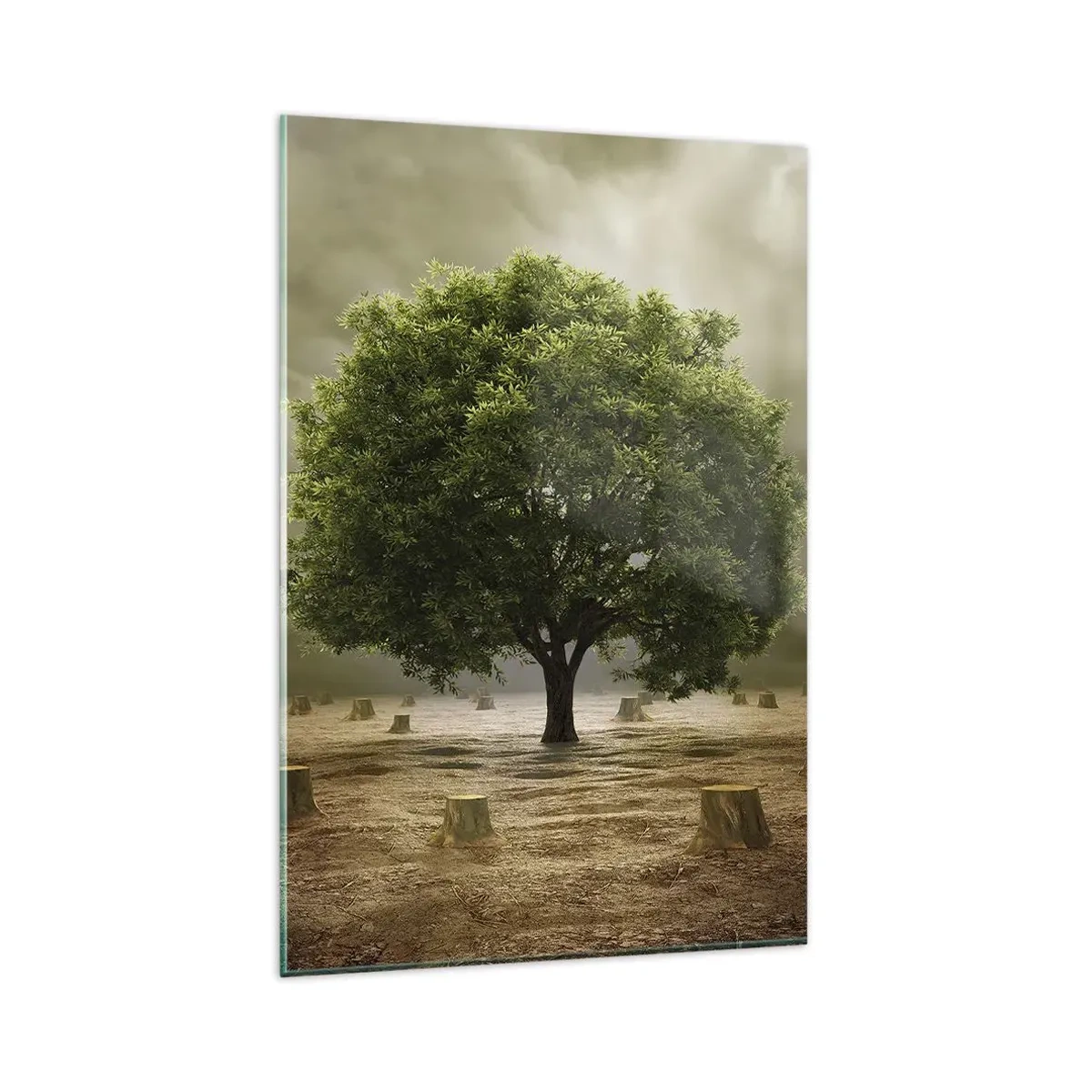 Glasbild - Bild auf glas - Ein grüner Baum, umgeben von gefällten Baumstämmen vor einem bewölkten Himmel - 80x120cm - Alle Hoffnung - Moderne Wanddekoration für Wohnzimmer und Schlafzimmer ARTTOR