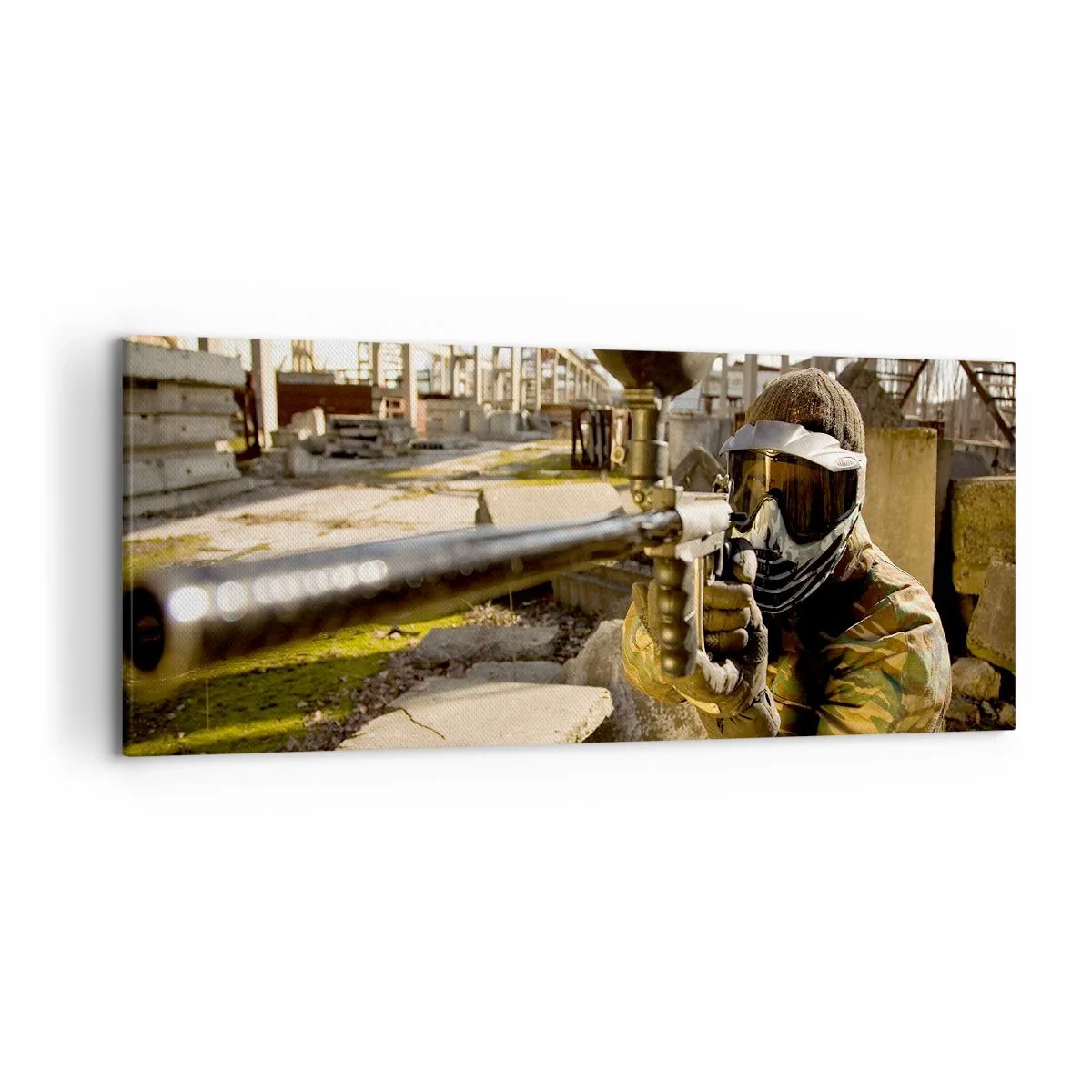 Bild auf Leinwand - Leinwandbild - Ein Paintball-Spieler in Tarnkleidung zielt mit einem Markierer - 120x50cm - Auch du kannst ein Held werden - Moderne Wanddekoration für Wohnzimmer und Schlafzimmer ARTTOR