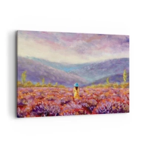 Bild auf Leinwand - Leinwandbild - Eine Frau mit Hut geht durch ein Lavendelfeld. - 100x70cm - In einer Lavendelwelt - Moderne Wanddekoration für Wohnzimmer und Schlafzimmer ARTTOR