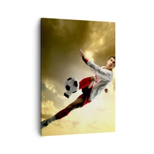 Bild auf Leinwand - Leinwandbild - Ein Fußballspieler in einem dynamischen Sprung kickt den Ball in den Himmel - 50x70cm - Fußballhimmel - Moderne Wanddekoration für Wohnzimmer und Schlafzimmer ARTTOR