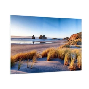 Glasbild - Bild auf glas - Ein Strand im Morgengrauen mit Gras und Felsen im Hintergrund und einem ruhigen Meer - 100x70cm - Für Friedenssuchende - Moderne Wanddekoration für Wohnzimmer und Schlafzimmer ARTTOR
