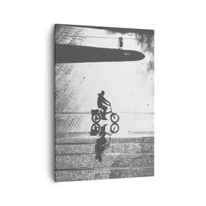 Bild auf Leinwand - Leinwandbild - Schwarz-weiße Silhouette eines Radfahrers auf einer nassen Straße - 50x70cm - Vor sich hin durch die Stadt - Moderne Wanddekoration für Wohnzimmer und Schlafzimmer ARTTOR