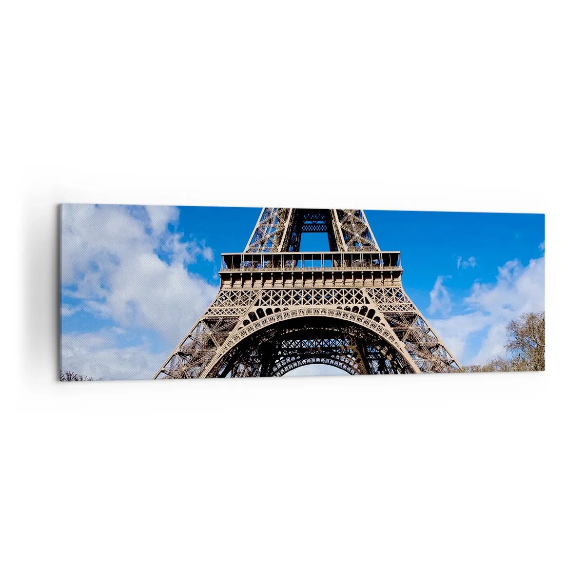 Bild auf Leinwand - Leinwandbild - Der Eiffelturm vor dem Hintergrund eines blauen Himmels und eines grünen Parks - 160x50cm - Ganz Paris zu ihren Füßen - Moderne Wanddekoration für Wohnzimmer und Schlafzimmer ARTTOR