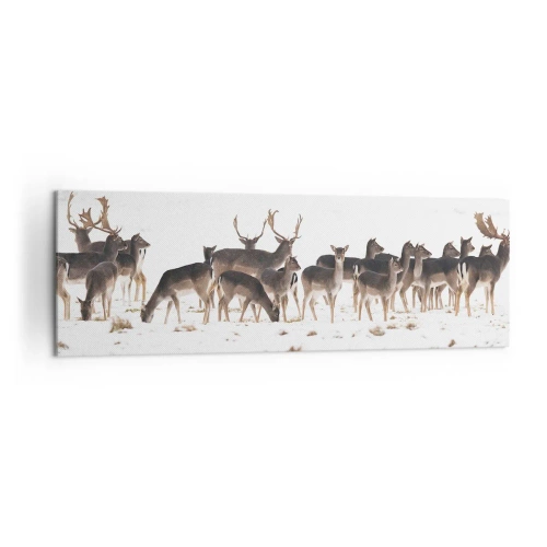 Bild auf Leinwand - Leinwandbild - Eine Herde Hirsche vor einem verschneiten Hintergrund - 160x50cm - Kommen die Weihnachten? - Moderne Wanddekoration für Wohnzimmer und Schlafzimmer ARTTOR