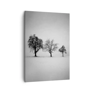 Bild auf Leinwand - Leinwandbild - Drei Bäume auf einem schneebedeckten Feld im monochromen Stil - 50x70cm - Wovon träumen sie? - Moderne Wanddekoration für Wohnzimmer und Schlafzimmer ARTTOR