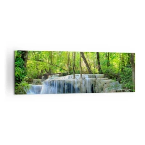 Bild auf Leinwand - Leinwandbild - Ein Wasserfall zwischen grünen Bäumen mit blauem Wasser in einer natürlichen Umgebung - 160x50cm - In Türkis und Grün ertrinken - Moderne Wanddekoration für Wohnzimmer und Schlafzimmer ARTTOR