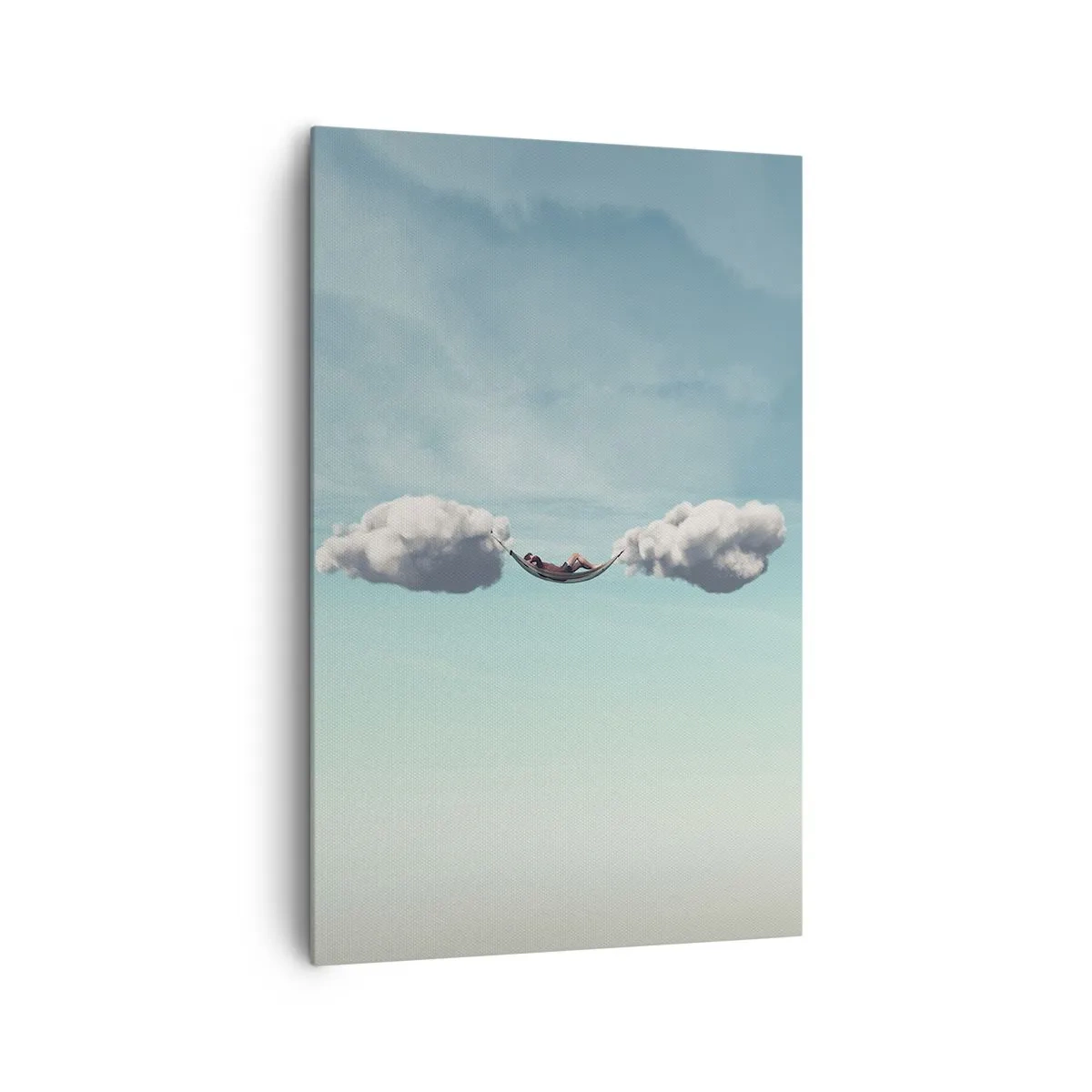 Bild auf Leinwand - Leinwandbild - Eine Person entspannt in einer Hängematte in den Wolken - 80x120cm - Die Behaglichkeit des Augenblicks - Moderne Wanddekoration für Wohnzimmer und Schlafzimmer ARTTOR