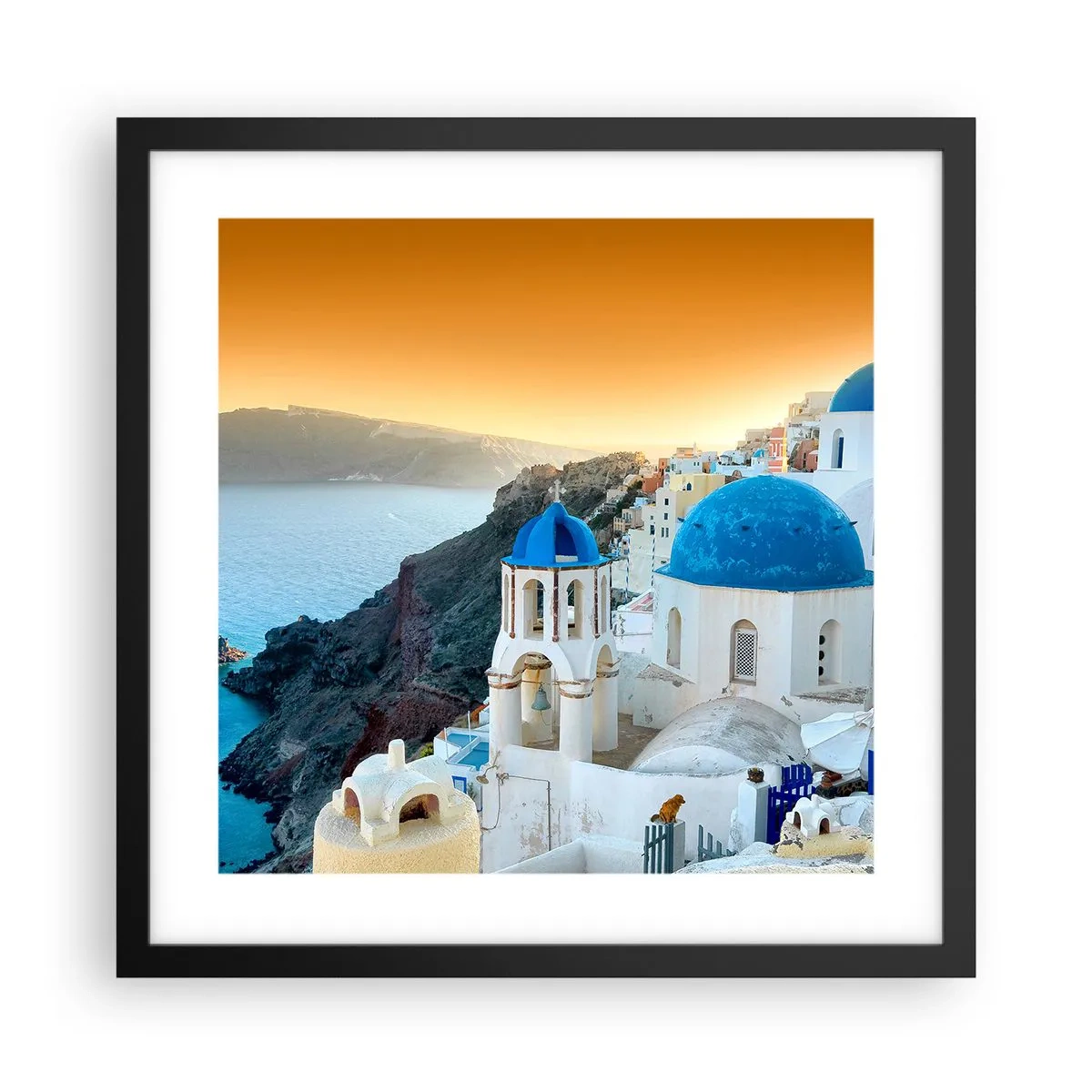 Poster in einem schwarzem Rahmen - Santorini - an die Felsen gekuschelt - 40x40 cm