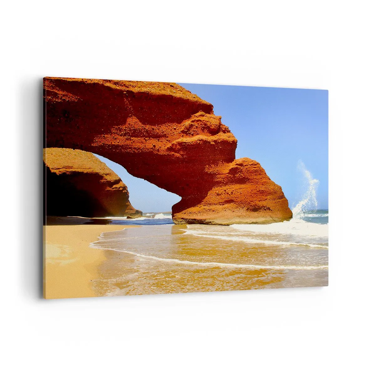 Bild auf Leinwand - Leinwandbild - Ein natürlicher Felsbogen an einem Strand mit blauem Himmel und Wellen - 100x70cm - Wasser und Wind seit Tausenden von Jahren - Moderne Wanddekoration für Wohnzimmer und Schlafzimmer ARTTOR