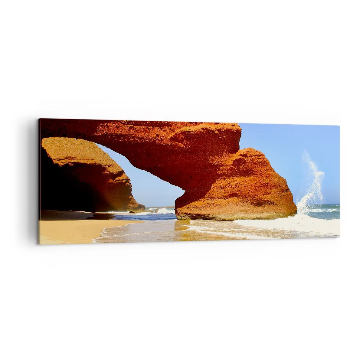 Bild auf Leinwand - Leinwandbild - Ein natürlicher Felsbogen an einem Strand mit blauem Himmel und Wellen - 140x50cm - Wasser und Wind seit Tausenden von Jahren - Moderne Wanddekoration für Wohnzimmer und Schlafzimmer ARTTOR