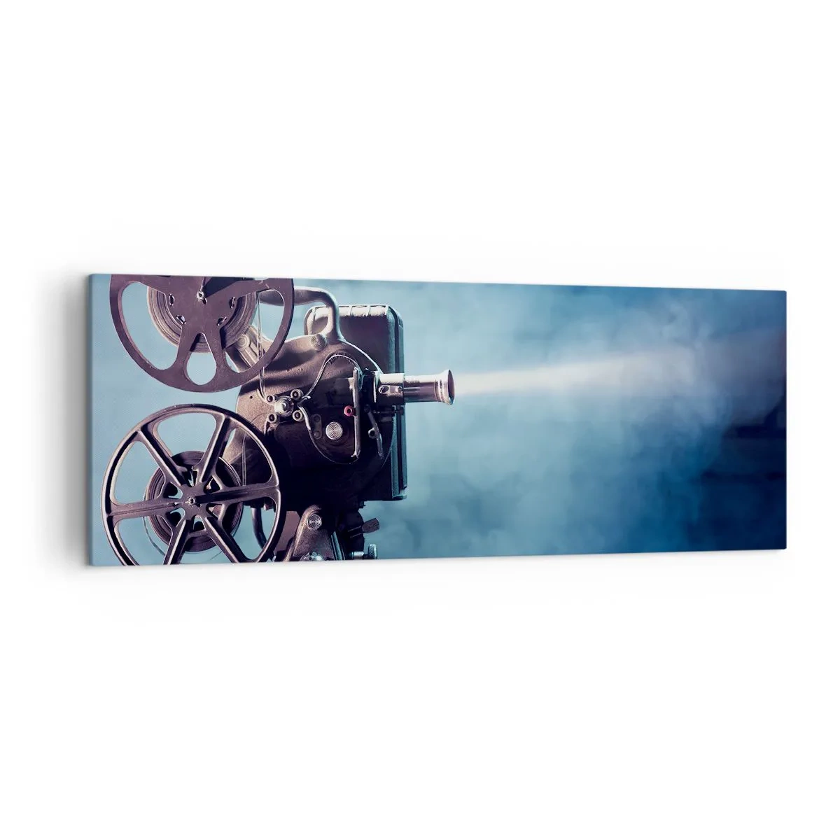 Bild auf Leinwand - Leinwandbild - Ein alter Filmprojektor wirft Licht vor einen blauen Hintergrund - 140x50cm - Im alten Kino - Moderne Wanddekoration für Wohnzimmer und Schlafzimmer ARTTOR
