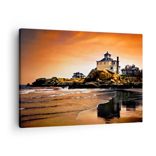 Bild auf Leinwand - Leinwandbild - Ein Haus auf einem Felsen am Strand bei Sonnenuntergang mit seiner Spiegelung im Wasser - 70x50cm - Eleganz der Westküste - Moderne Wanddekoration für Wohnzimmer und Schlafzimmer ARTTOR