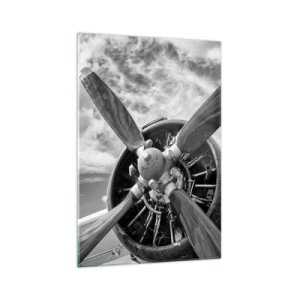Glasbild - Bild auf glas - Ein Schwarzweißfoto eines Flugzeugpropellers vor einem dynamischen Himmel. - 70x100cm - Eroberer der Lüfte - Moderne Wanddekoration für Wohnzimmer und Schlafzimmer ARTTOR
