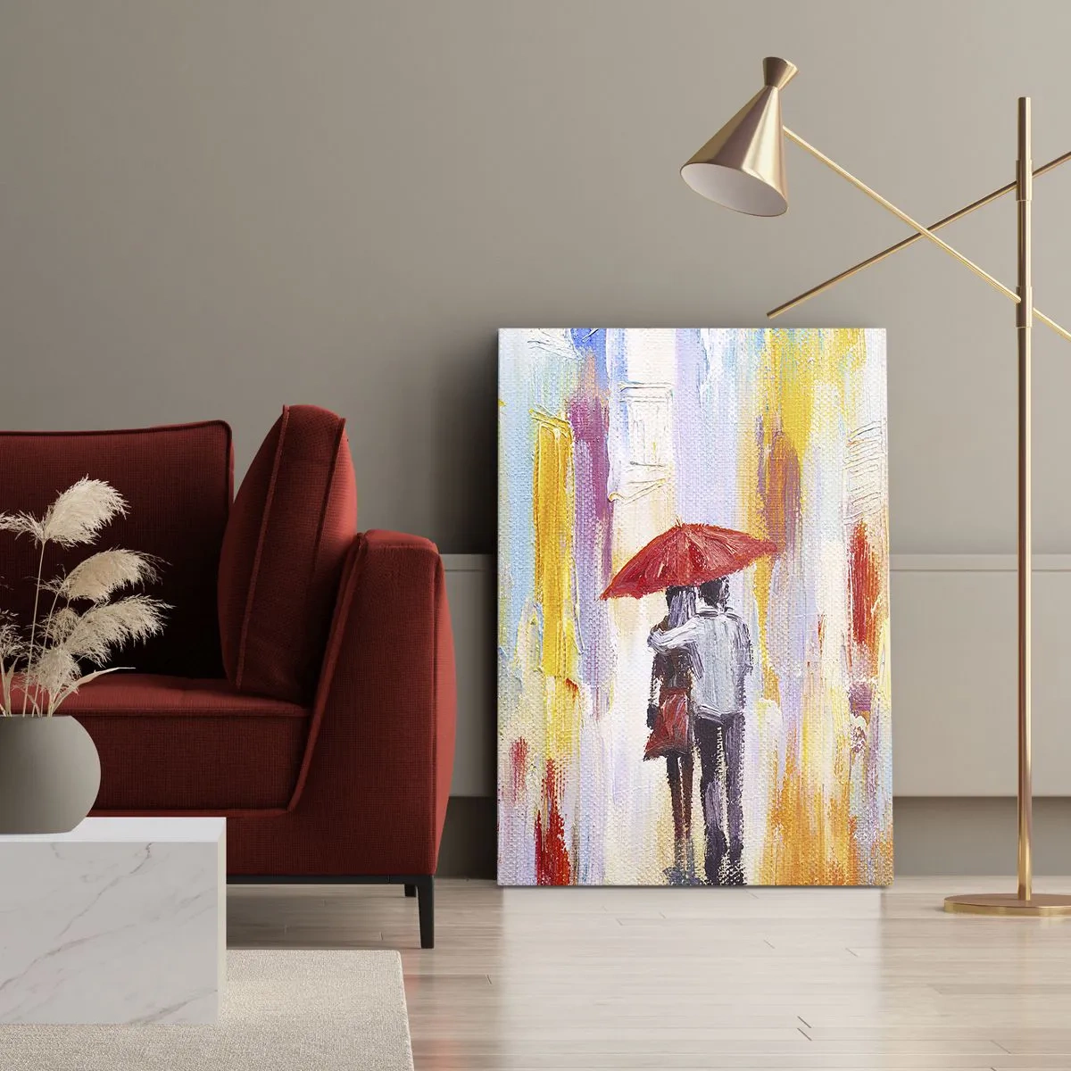 Bild auf Leinwand - Leinwandbild - Ein Paar unter einem roten Regenschirm mit bunten Gebäuden im Hintergrund. - 50x70cm - Lass es weiter regnen - Moderne Wanddekoration für Wohnzimmer und Schlafzimmer ARTTOR