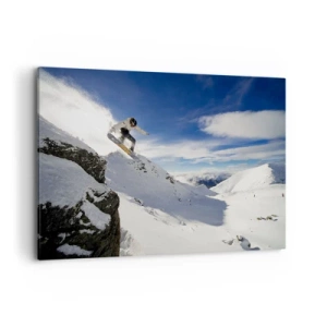 Bild auf Leinwand - Leinwandbild - Ein Snowboarder springt von einer Klippe mit schneebedeckten Bergen im Hintergrund. - 100x70cm - Freiheit ohne Grenzen - Moderne Wanddekoration für Wohnzimmer und Schlafzimmer ARTTOR