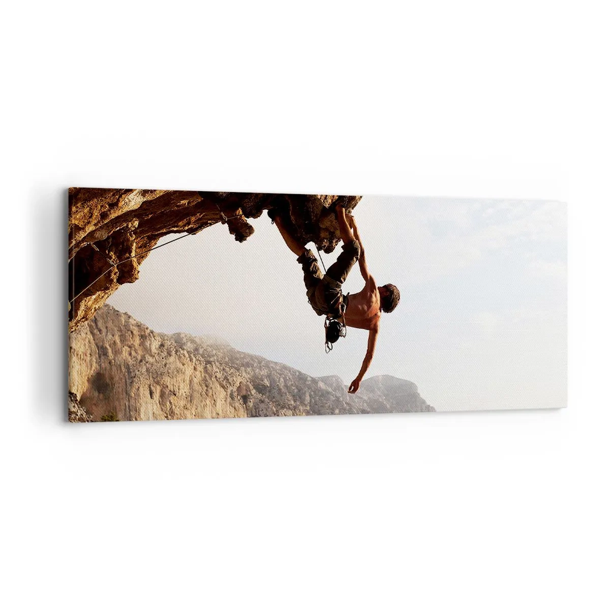 Bild auf Leinwand - Leinwandbild - Ein Kletterer auf einer steilen Klippe in den Bergen im Sonnenschein - 120x50cm - Die Welt ist in einer Hand auf einem Felsblock geschrumpft - Moderne Wanddekoration für Wohnzimmer und Schlafzimmer ARTTOR