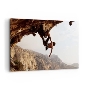 Bild auf Leinwand - Leinwandbild - Ein Kletterer auf einer steilen Klippe in den Bergen im Sonnenschein - 120x80cm - Die Welt ist in einer Hand auf einem Felsblock geschrumpft - Moderne Wanddekoration für Wohnzimmer und Schlafzimmer ARTTOR