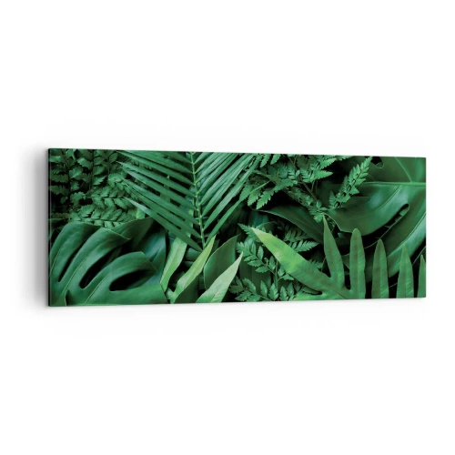 Bild auf Leinwand - Leinwandbild - Grüne tropische Blätter in einer dichten und natürlichen Komposition - 140x50cm - Eingebettet ins Grüne - Moderne Wanddekoration für Wohnzimmer und Schlafzimmer ARTTOR