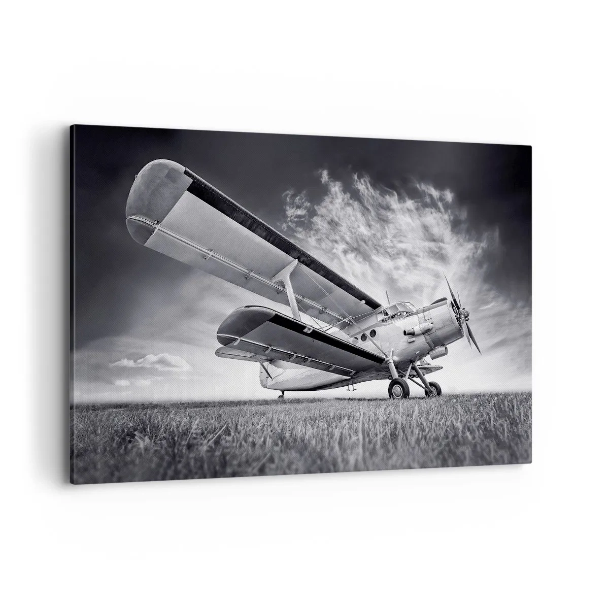 Bild auf Leinwand - Leinwandbild - Ein Flugzeug vor einem dramatischen Himmel in Schwarzweiß - 120x80cm - Der geflügelte Wanderer - Moderne Wanddekoration für Wohnzimmer und Schlafzimmer ARTTOR