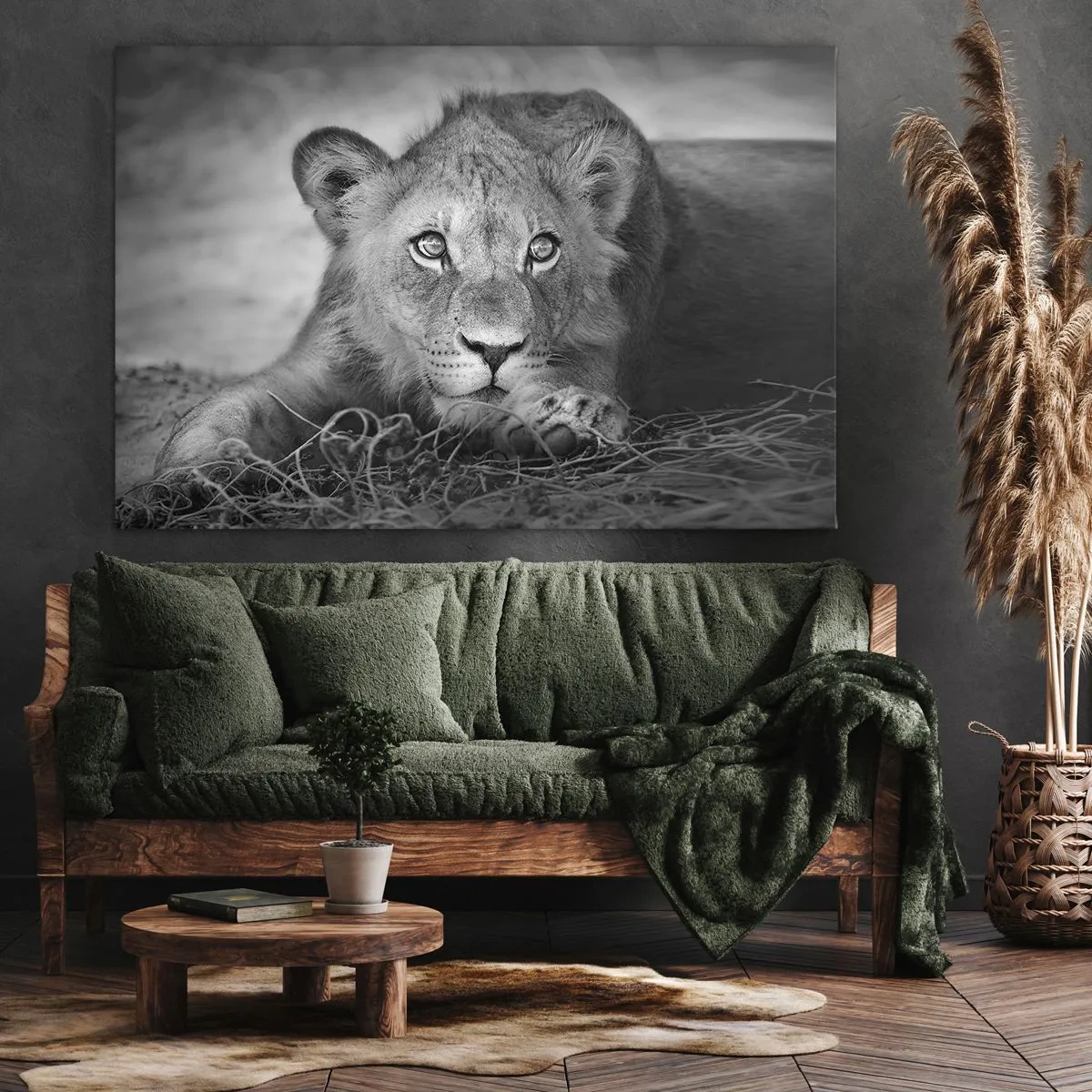 Bild auf Leinwand - Leinwandbild - Monochromes Porträt eines liegenden jungen Löwen - 70x50cm - Königlicher Welpe - Moderne Wanddekoration für Wohnzimmer und Schlafzimmer ARTTOR