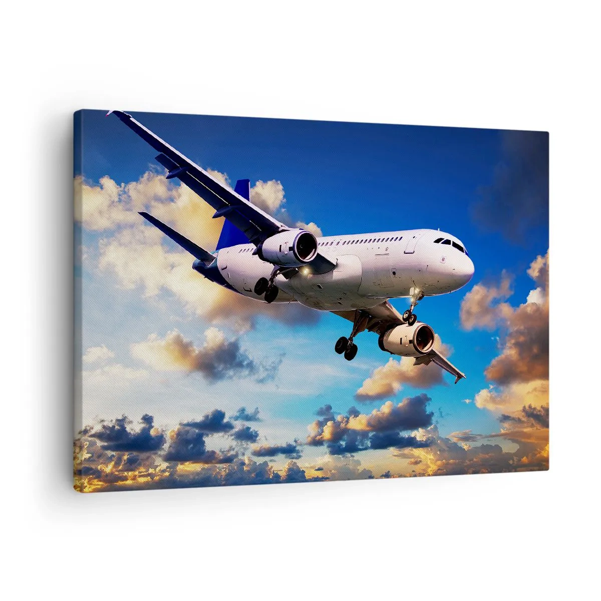 Bild auf Leinwand - Leinwandbild - Ein Passagierflugzeug vor den Wolken bei Sonnenuntergang - 70x50cm - Eine Reise in Weiß und Blau - Moderne Wanddekoration für Wohnzimmer und Schlafzimmer ARTTOR