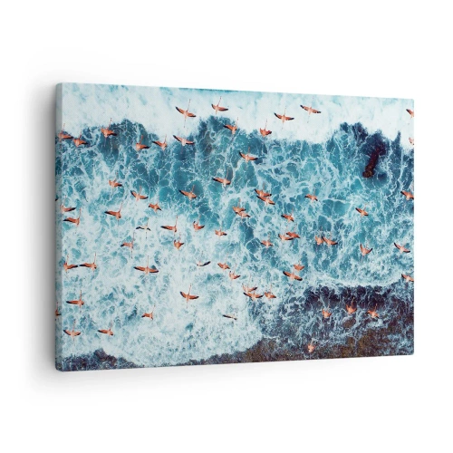 Bild auf Leinwand - Leinwandbild - Eine Vogelperspektive auf rosa Flamingos über einem blauen Ozean - 70x50cm - Die Küstenparade - Moderne Wanddekoration für Wohnzimmer und Schlafzimmer ARTTOR