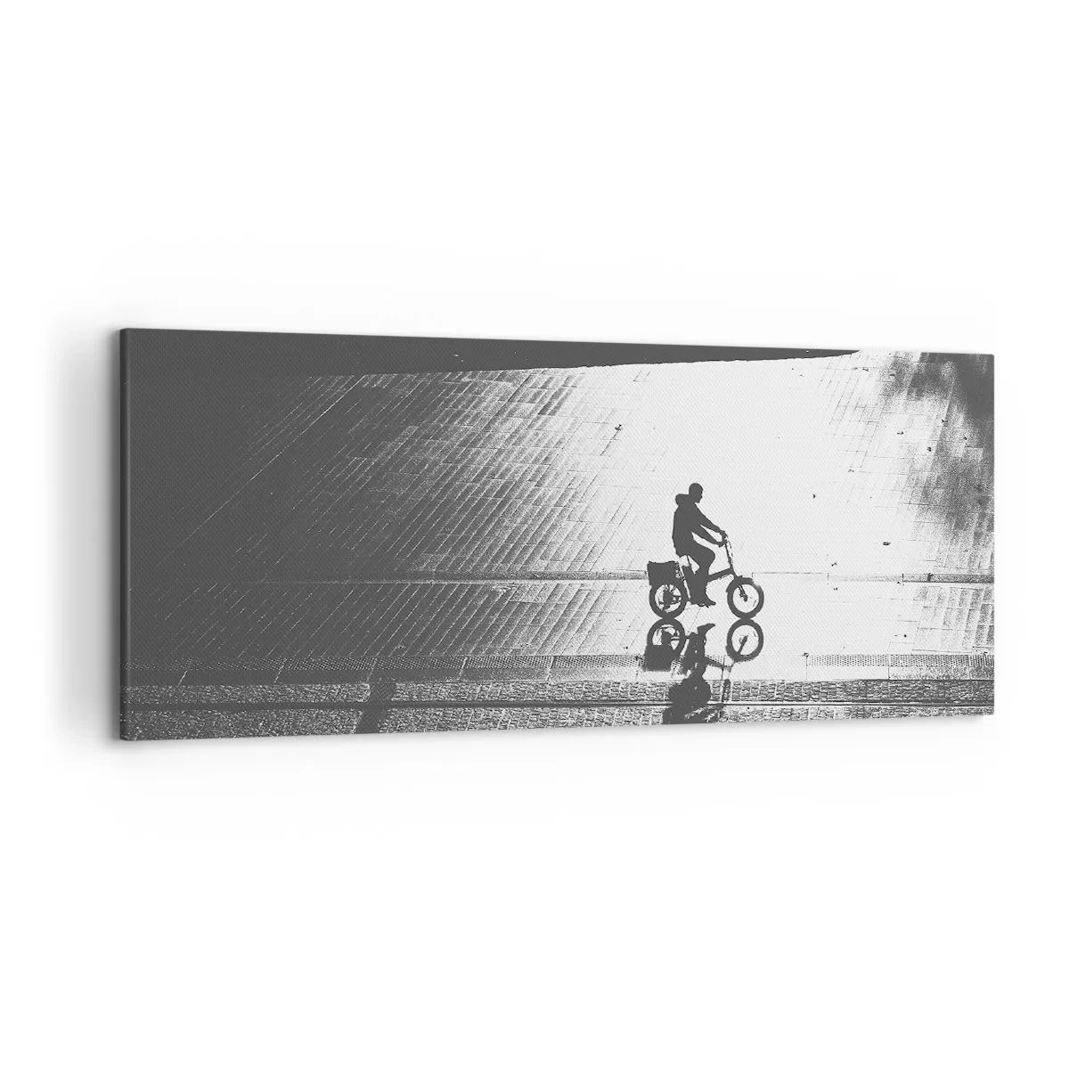 Bild auf Leinwand - Leinwandbild - Schwarz-weiße Silhouette eines Radfahrers auf einer nassen Straße - 120x50cm - Vor sich hin durch die Stadt - Moderne Wanddekoration für Wohnzimmer und Schlafzimmer ARTTOR