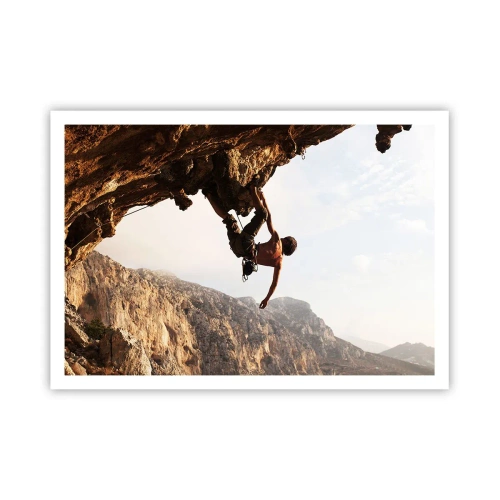 Poster - Ein Kletterer auf einer steilen Klippe in den Bergen im Sonnenschein - 100x70cm - Die Welt ist in einer Hand auf einem Felsblock geschrumpft - Moderne Wanddekoration für Wohnzimmer und Schlafzimmer ARTTOR