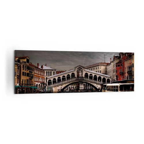 Bild auf Leinwand - Leinwandbild - Rialtobrücke in Venedig über den Canal Grande, klassische Architektur. - 160x50cm - Das Versprechen eines venezianischen Abends - Moderne Wanddekoration für Wohnzimmer und Schlafzimmer ARTTOR