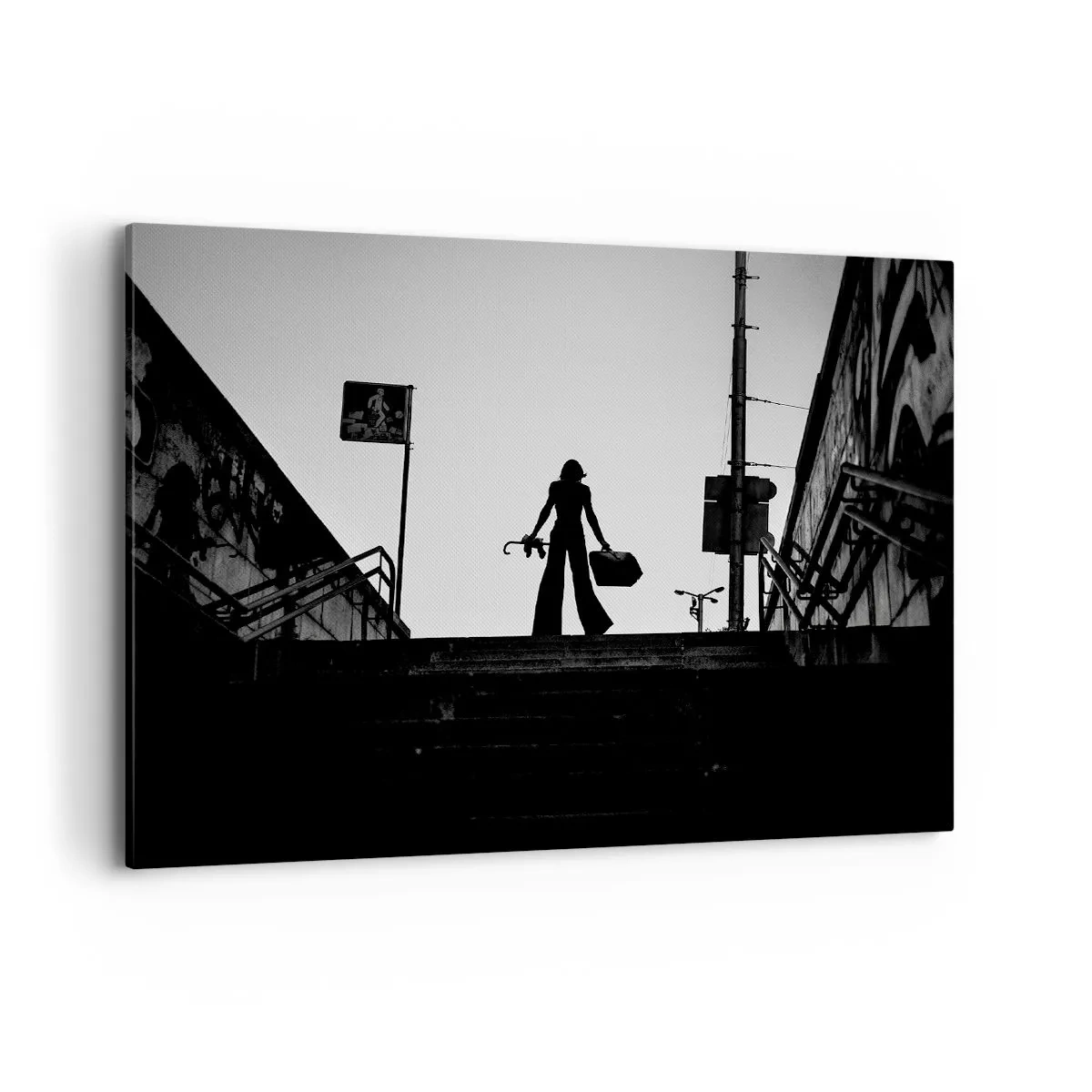 Bild auf Leinwand - Leinwandbild - Eine Frauenfigur auf der Treppe in Schwarzweiß mit dynamischer Atmosphäre - 100x70cm - Städtisches Wandern - Moderne Wanddekoration für Wohnzimmer und Schlafzimmer ARTTOR
