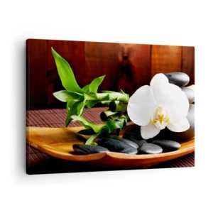 Bild auf Leinwand - Leinwandbild - Weiße Orchidee mit Bambus vor einem Steinhintergrund im Zen-Stil - 70x50cm - Geben Sie sich dem Hauch der Natur hin - Moderne Wanddekoration für Wohnzimmer und Schlafzimmer ARTTOR