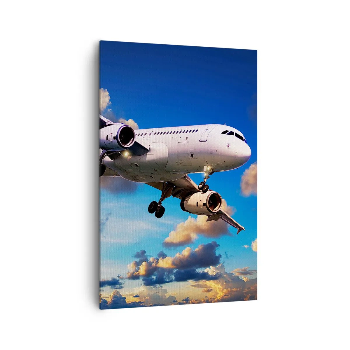 Bild auf Leinwand - Leinwandbild - Ein Passagierflugzeug vor den Wolken bei Sonnenuntergang - 80x120cm - Eine Reise in Weiß und Blau - Moderne Wanddekoration für Wohnzimmer und Schlafzimmer ARTTOR