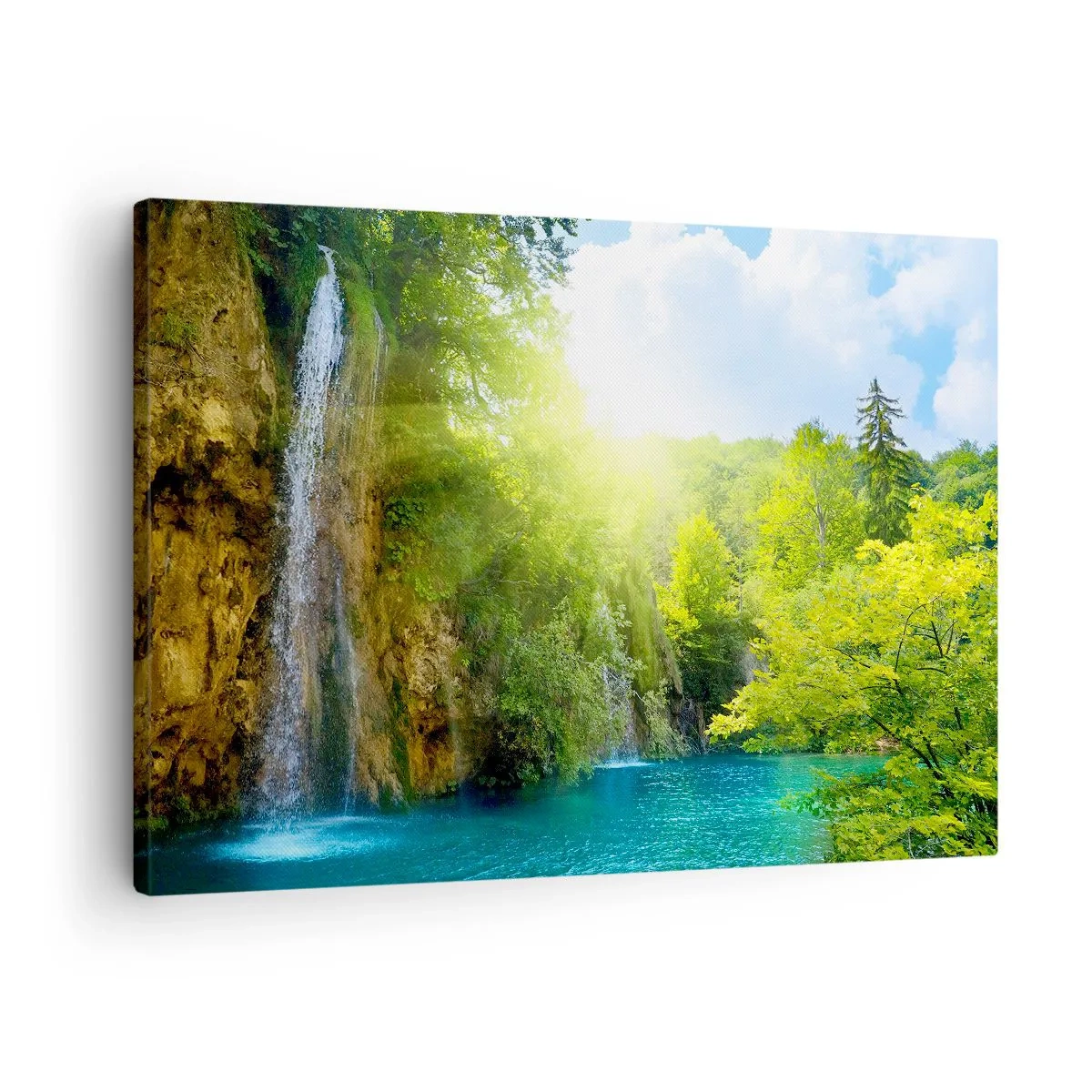 Bild auf Leinwand - Leinwandbild - Ein Wasserfall, der in einen türkisfarbenen See fließt, umgeben von Grün - 70x50cm - Es muss Eden sein - Moderne Wanddekoration für Wohnzimmer und Schlafzimmer ARTTOR