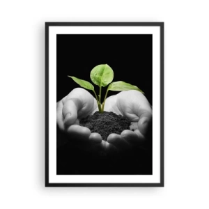 Poster in einem schwarzem Rahmen - Eine Pflanze in den Händen symbolisiert Leben und Natur - 50x70cm - Ich liebe die Natur, ich beschütze sie - Moderne Wanddekoration für Wohnzimmer und Schlafzimmer ARTTOR