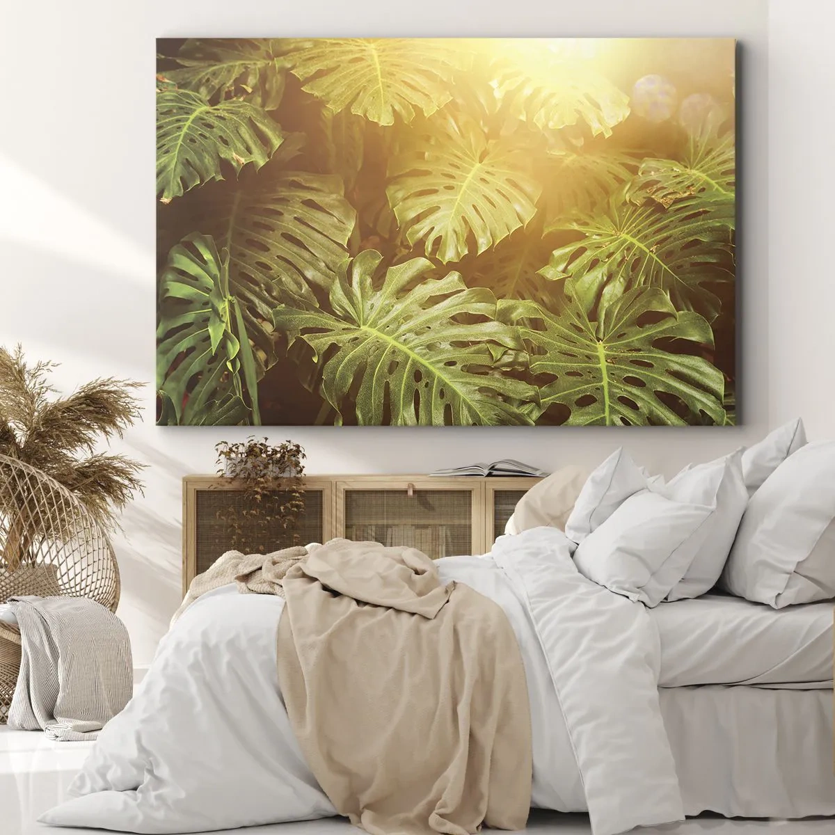 Bild auf Leinwand - Leinwandbild - Monstera-Blätter im Sonnenlicht vor einem natürlichen Hintergrund - 70x50cm - Ins Grüne tretren... - Moderne Wanddekoration für Wohnzimmer und Schlafzimmer ARTTOR