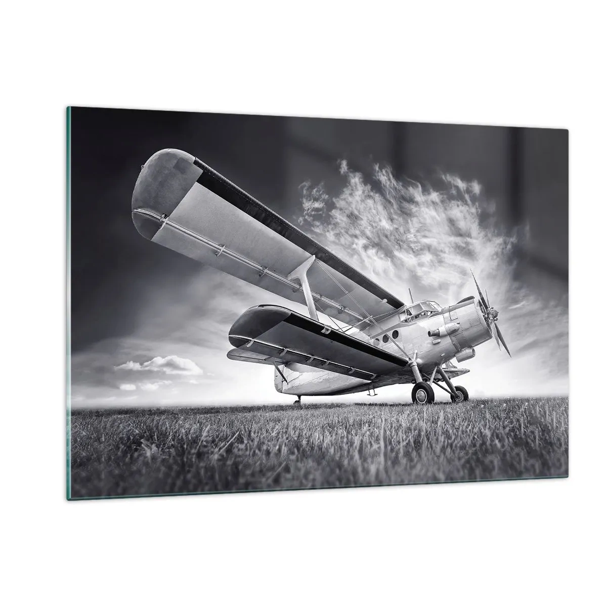 Glasbild - Bild auf glas - Ein Schwarzweißfoto eines Flugzeugs vor einem dramatischen Himmel. - 120x80cm - Der geflügelte Wanderer - Moderne Wanddekoration für Wohnzimmer und Schlafzimmer ARTTOR