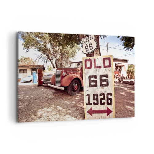 Bild auf Leinwand - Leinwandbild - Retro-Auto und Route 66-Schild in rustikalem Ambiente - 100x70cm - Die Legende der amerikanischen Provinz - Moderne Wanddekoration für Wohnzimmer und Schlafzimmer ARTTOR