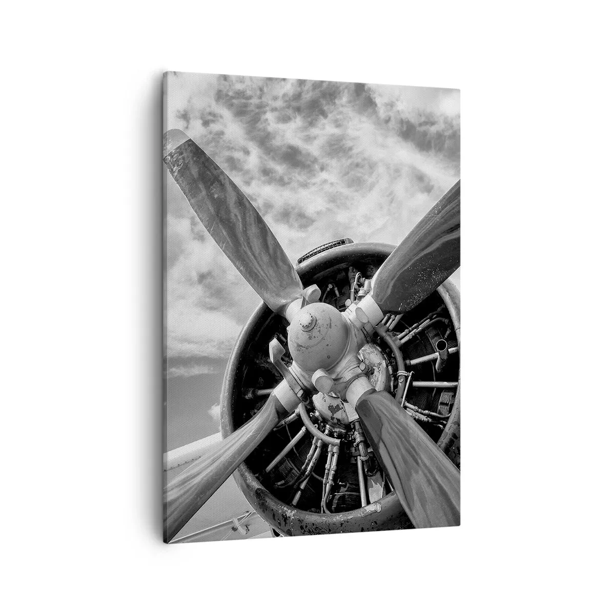 Bild auf Leinwand - Leinwandbild - Ein Schwarzweißfoto eines Flugzeugpropellers vor einem dynamischen Himmel. - 50x70cm - Eroberer der Lüfte - Moderne Wanddekoration für Wohnzimmer und Schlafzimmer ARTTOR