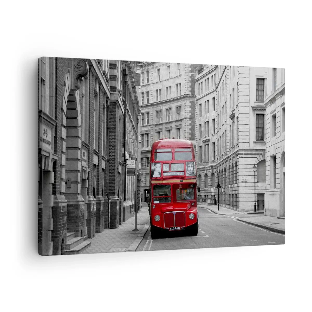 Bild auf Leinwand - Leinwandbild - Ein roter Bus vor einem Hintergrund aus schwarz-weißen Stadtgebäuden. - 70x50cm - Der Alltag muss nicht grau sein - Moderne Wanddekoration für Wohnzimmer und Schlafzimmer ARTTOR