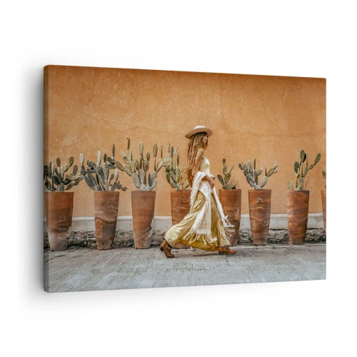 Bild auf Leinwand - Leinwandbild - Eine Frau im Boho-Stil mit Töpfen voller Kakteen im Hintergrund. - 70x50cm - Hippie-Stil - Moderne Wanddekoration für Wohnzimmer und Schlafzimmer ARTTOR