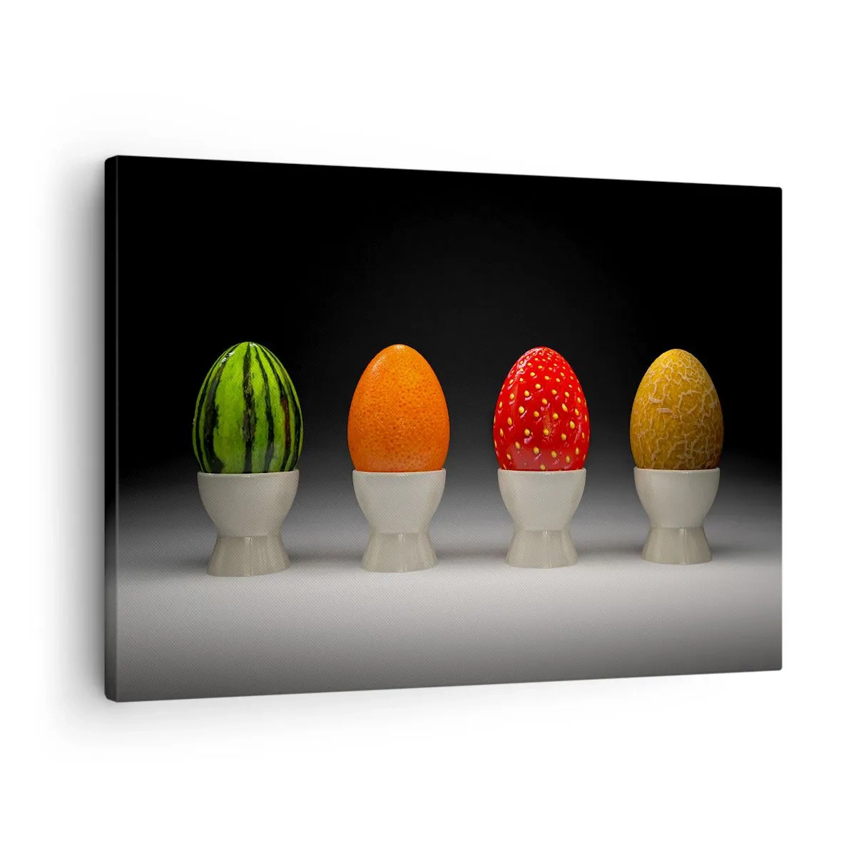 Bild auf Leinwand - Leinwandbild - Bunte Eier, die Früchten ähneln, auf dunklem Hintergrund - 70x50cm - Obstfrühstück - Moderne Wanddekoration für Wohnzimmer und Schlafzimmer ARTTOR