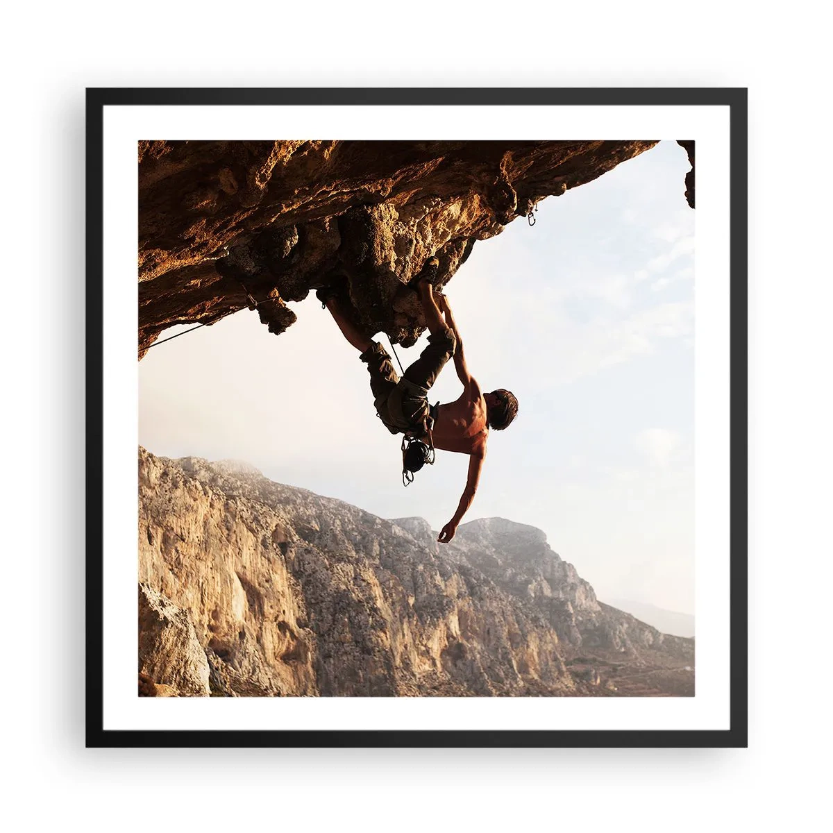 Poster in einem schwarzem Rahmen - Die Welt ist in einer Hand auf einem Felsblock geschrumpft - 60x60 cm