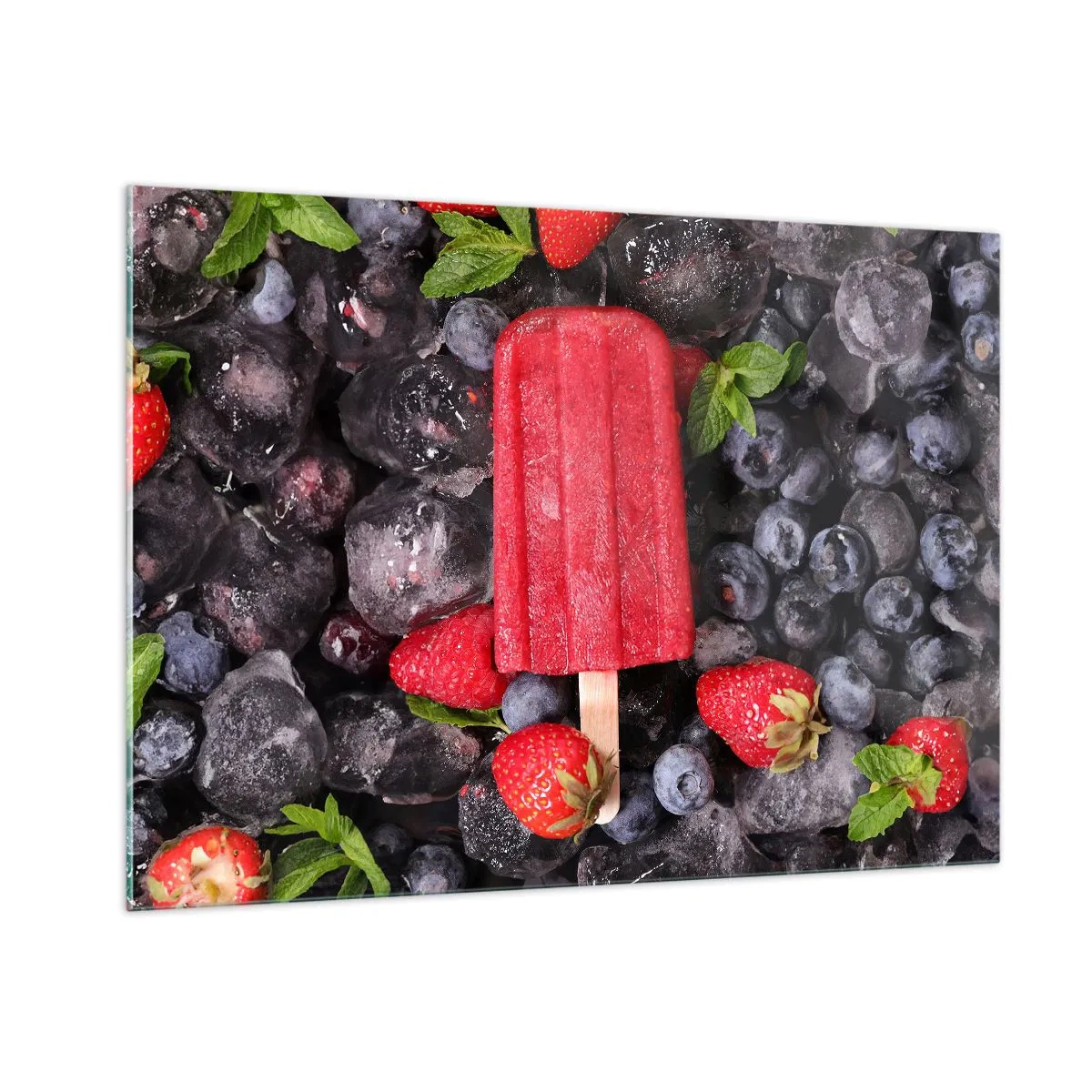 Glasbild - Bild auf glas - Ein Eisstiel zwischen gefrorenen Früchten und Minzblättern - 100x70cm - So schmeckt der heiße Sommer - Moderne Wanddekoration für Wohnzimmer und Schlafzimmer ARTTOR