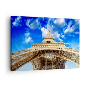 Bild auf Leinwand - Leinwandbild - Der Eiffelturm von unten vor blauem Himmel - 70x50cm - In den Himmel und in die Wolken gehen - Moderne Wanddekoration für Wohnzimmer und Schlafzimmer ARTTOR