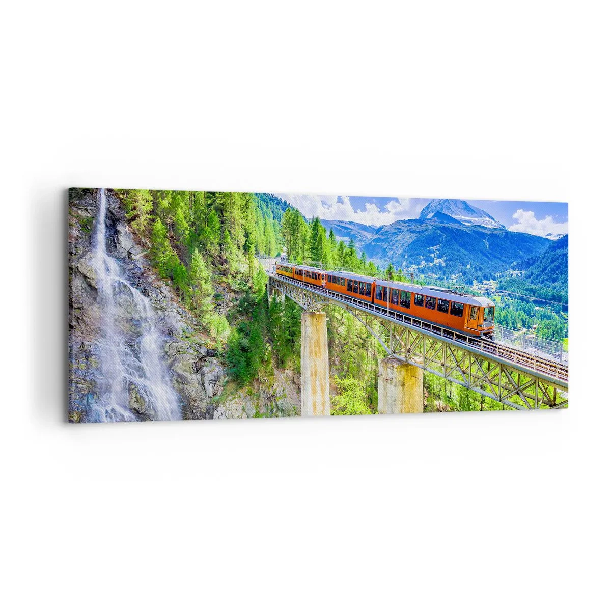 Bild auf Leinwand - Leinwandbild - Eine Achterbahn auf einer Brücke mit Blick auf einen Wasserfall und Berge - 120x50cm - Jetzt sind Alpen dran - Moderne Wanddekoration für Wohnzimmer und Schlafzimmer ARTTOR